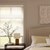 Vignette of a Transitional Bedroom scene of the 2in. Faux Wood Blinds in the Wood Texture Pearl color with the Modern Valance and Inside Mount.