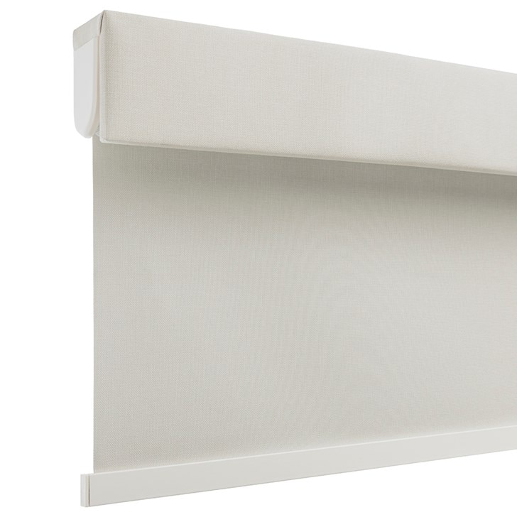 The Motorized Blackout Roller Shades in the Catania Off-White color with the Fabric Wrapped 4in. Cornice.