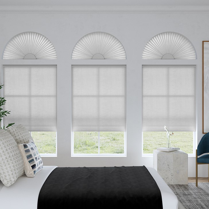 Light Filtering Arch and Light Filtering Cellular Shades in the Gray Sheen color.