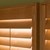 Detailed close up shot of the premium wood shutters in the golden oak color.