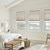 Bali Light Filtering Cellular Shades in Subtle Touch 0723 shown in bedroom scene