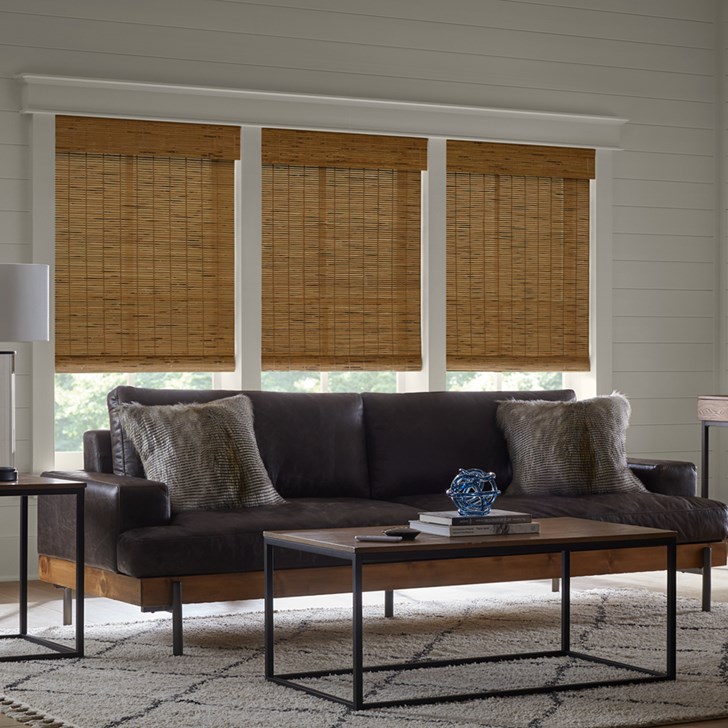 Motorized Woven Wood Shades in the Malibu Caramel color.