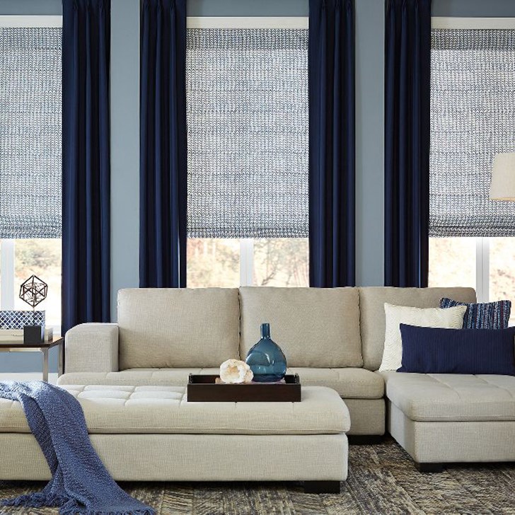 Layering your window treatments is a beautiful way to increase light control. Shown in Ashton Stripe Navy over our Classic Roman Shade in Limburg Windmill Blue.