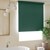 Vignette of a Modern Bathroom scene of the Economy Blackout Vinyl Roller Shades in the Reminiscent Hunter Green color with the 3in. Fabric Covered Valance and Outside Mount.