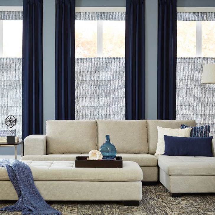 Layering your window treatments is a beautiful way to increase light control. Shown in Ashton Stripe Navy over our Classic Roman Shade in Limburg Windmill Blue.